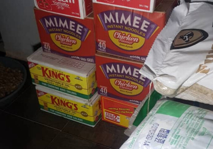 boxes of food items and bags of food items stacked up
